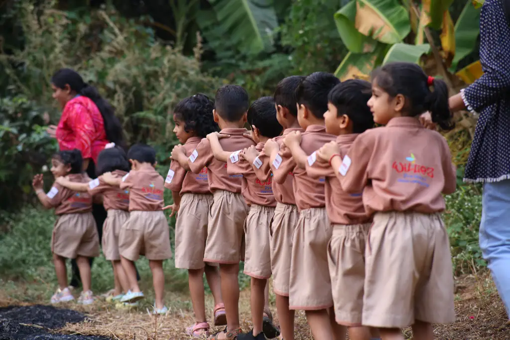 Children in Williez uniform walking together in a line outdoors