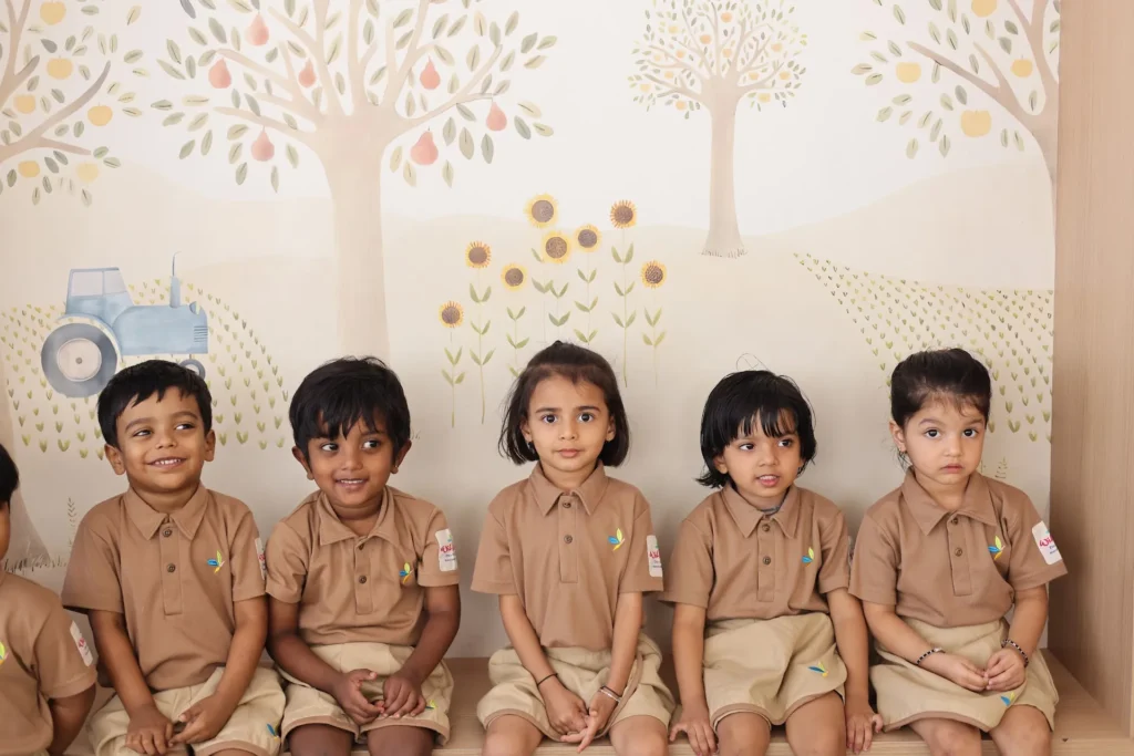 Preschool children sitting together for circle time at Williez Preschool, India