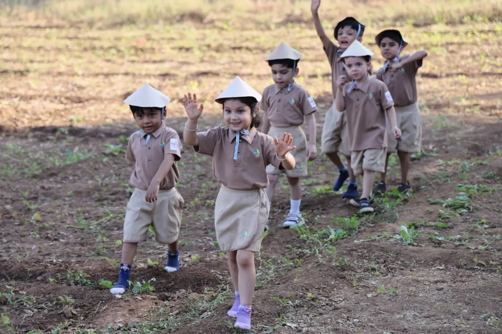 Happy children on an outdoor field trip at Williez Preschool, India